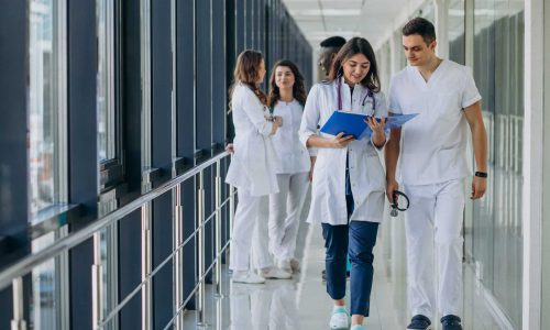 team-young-specialist-doctors-standing-corridor-hospital